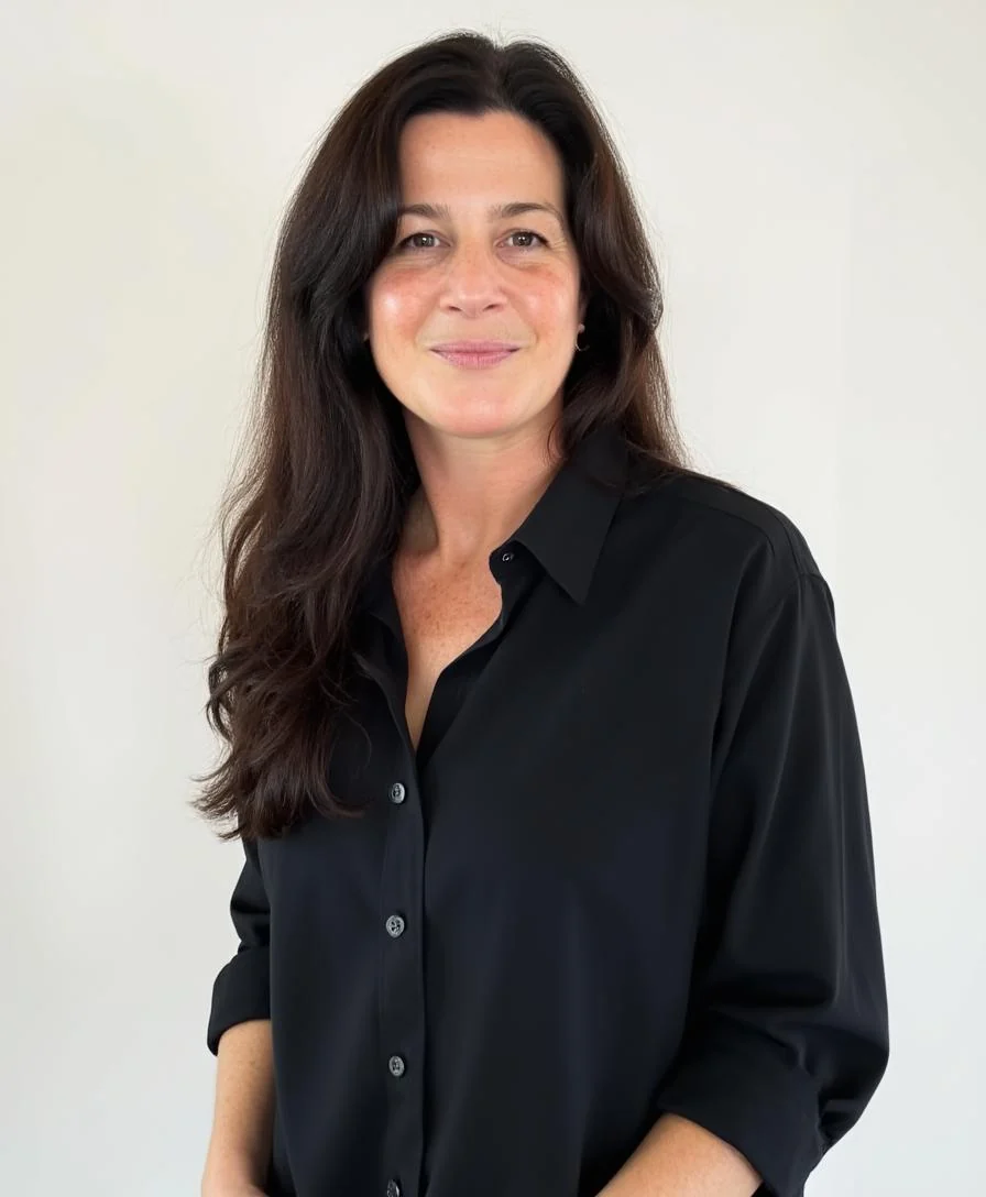 Jen Nickles, CFO and co-founder of JDS1 Marketing and Dental SEO Pros, smiling in a black button-down shirt